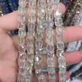 Detailed view of 8x9mm iridescent faceted cylindrical glass crystal beads for DIY jewelry - Cylinder / Crystal Yellow