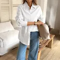 Casual white long-sleeve button-up shirt for women in a leisure lifestyle setting - XS / White