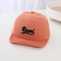 Soft coral orange baby baseball cap featuring black Royal embroidery, ideal for toddlers - Orange Red Letter Print Style