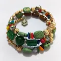 Close-up of retro multilayer wrap bracelet with green turquoise stones and colorful beads - Green Gradient