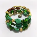 Close-up detail of a vintage bohemian multi-layer wrap bracelet with turquoise beads - Green