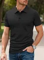 Detailed view of a black men's short-sleeved polo shirt worn by a model outdoors - S / Black