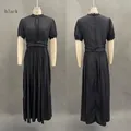 Vista anteriore e posteriore di un elegante abito lungo nero con pizzo e pieghe - 3XL / Nero