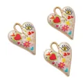 Detalle de colgantes de corazón con motivos de ojos y flores pintados a mano a todo color - Estilo 4