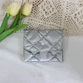 Close-up of a silver metallic quilted PU leather small coin purse with snap button - Bubble Rhombus Silver