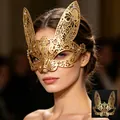 Detailed view of a golden filigree rabbit masquerade mask with sparkling rhinestones - Rabbit