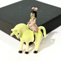 Handcrafted enamel cartoon girl on horse brooch pin in vibrant lime green and pink - Girl on Bull (XH-707)