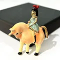 Enamel brooch featuring a girl riding an orange bull, artistic clothing accessory - Girl Riding Bull Style (XH-708)