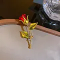 Elegant red rose brooch featuring green leaves and a golden stem for women's fashion - Red Rose (XH-916)