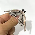 Sparkling rose gold dragonfly brooch adorned with clear rhinestones and black accents - Rhinestone Dragonfly (XH-728)