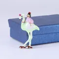 Elegant pastel enamel flamingo brooch featuring a girl figure sitting on its back - Fairytale Flamingo Style (MYL-1351)