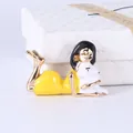 Cute enamel brooch with a stylized girl in a yellow dress holding a little white cat - Girl in Yellow Dress and Cat Style (XH-1372)