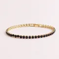 Elegante bracciale tennis dorato con pietre di zircone nero a taglio rotondo. - Oro-Nero