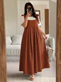Plus size burnt orange pinafore dress styled with a white t-shirt in a home setting - 3XL / Top And Bottom / Brown