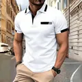 Detailed close-up of men's slim fit white polo shirt with black contrast collar and pocket. - White