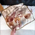 Elegant square silk scarf featuring a sophisticated brown leaf and butterfly print design. - 78 Square Scarves / 65
