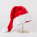 Premium classic plush red and white Santa hat presented on a stylish gold metal stand - Luxury Thickened Long Plush Long Tail Adult