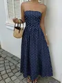 Close-up of navy blue strapless dress with elegant white polka dots and ruched waist - S / Navy Blue