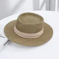 Elegant wide-brimmed straw sun hat with decorative beige ribbon for beach vacations - Mat Straw Hat Beige