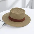 Elegant women's woven straw sun hat with wide brim and contrasting brown ribbon band - Straw Hat Coffee