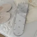 Elegant grey ultra-thin mesh crew socks featuring delicate mini bow tie accents for women - One Size / Flocked Bow-Gray