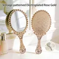 Elegant vintage floral handheld makeup mirror with rose gold electroplated finish - 11.5*25cm / Rose Gold