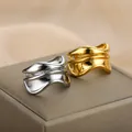 Modern wavy geometric stainless steel rings in polished gold and silver finishes - Wave Geometric Multi-layer Hollow Style (JZ2238)