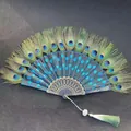 Handcrafted Chinese style folding fan featuring authentic peacock feathers and blue sequins embroidery - Single Piece / Lake Blue (Peacock Feather Embroidery Style)