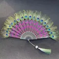 Detailed view of elegant peacock feather folding fan with pink sequin embroidery - Single Piece / Rose Red (Peacock Feather Embroidery Style)