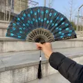 Detail view of Chinese folding fan featuring blue sequin embroidery on black fabric - Single Piece / Lake Blue (Sequin Embroidery Style)