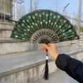 Handheld black embroidery folding fan with vibrant green sequins and decorative tassel. - Single Piece / Green (Sequin Embroidery Style)
