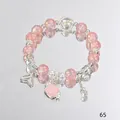 Pink crystal beaded bracelet with shell and fishtail charms on a mirror background - Shell Fish Tail Pink