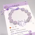 Handmade lavender purple crystal beaded bracelet featuring a cute transparent cat charm. - Glass Spirit Fox Mask Purple