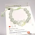 Elegant forest style pale green beaded bracelet featuring an iridescent fox head charm - Glass Spirit Fox Mask Green