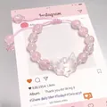 Pink crystal beaded bracelet featuring a clear cat-head charm and adjustable pink cord - Glass Spirit Fox Mask Pink