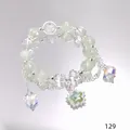 Elegant forest style crystal bracelet featuring star charms and translucent green beads - Star Clover Bracelet Green