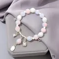 Elegant forest-style crystal bracelet featuring star charms and a lucky cat pendant. - Lucky Cat Blue-Pink
