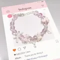 Forest style pink crystal beaded bracelet with white flower and bow charms for women - Ballet Rose Pink