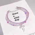 Handmade purple crystal beaded double layer bracelet with silver butterfly bow pendant - Ballet Style Bow Seed Bead Purple