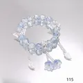 Elegant starry blue crystal beaded bracelet featuring silver butterfly and flower charms - Shining Orchid Blue