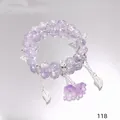 Elegant purple crystal beaded bracelet featuring silver butterfly and bell flower charms - Shining Orchid Purple