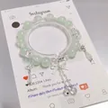 Elegant green crystal bead bracelet featuring silver butterfly and bow charms for women - Bow Tassel Crystal Green