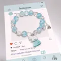 Niche design blue crystal beaded bracelet featuring a silver horse charm and tassel - Success Horse Bracelet Blue