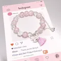 Forest style pink crystal bead bracelet with silver charms and pink tassel accessory - Success Horse Bracelet Pink