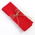Red cotton linen napkin tied with jute twine for festive table decoration - Red