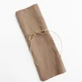Rustic brown cotton linen cloth napkin tied with natural twine bow for table setting - Coffee