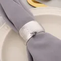 Detail of premium silver hammered texture metal napkin ring on elegant gray fabric napkin - Honeycomb Hammered Style / Silver