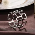 Elegant silver geometric hollow metal napkin ring for luxury dining table setting - Great Wall Pattern Hollow Style / Silver