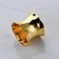 Golden creative hollow metal napkin ring featuring an organic irregular crushed texture - Irregular Wave Shape / Gold