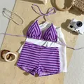 Detail shot of purple striped terry cloth bikini set with summer vacation accessories. - Purple Striped